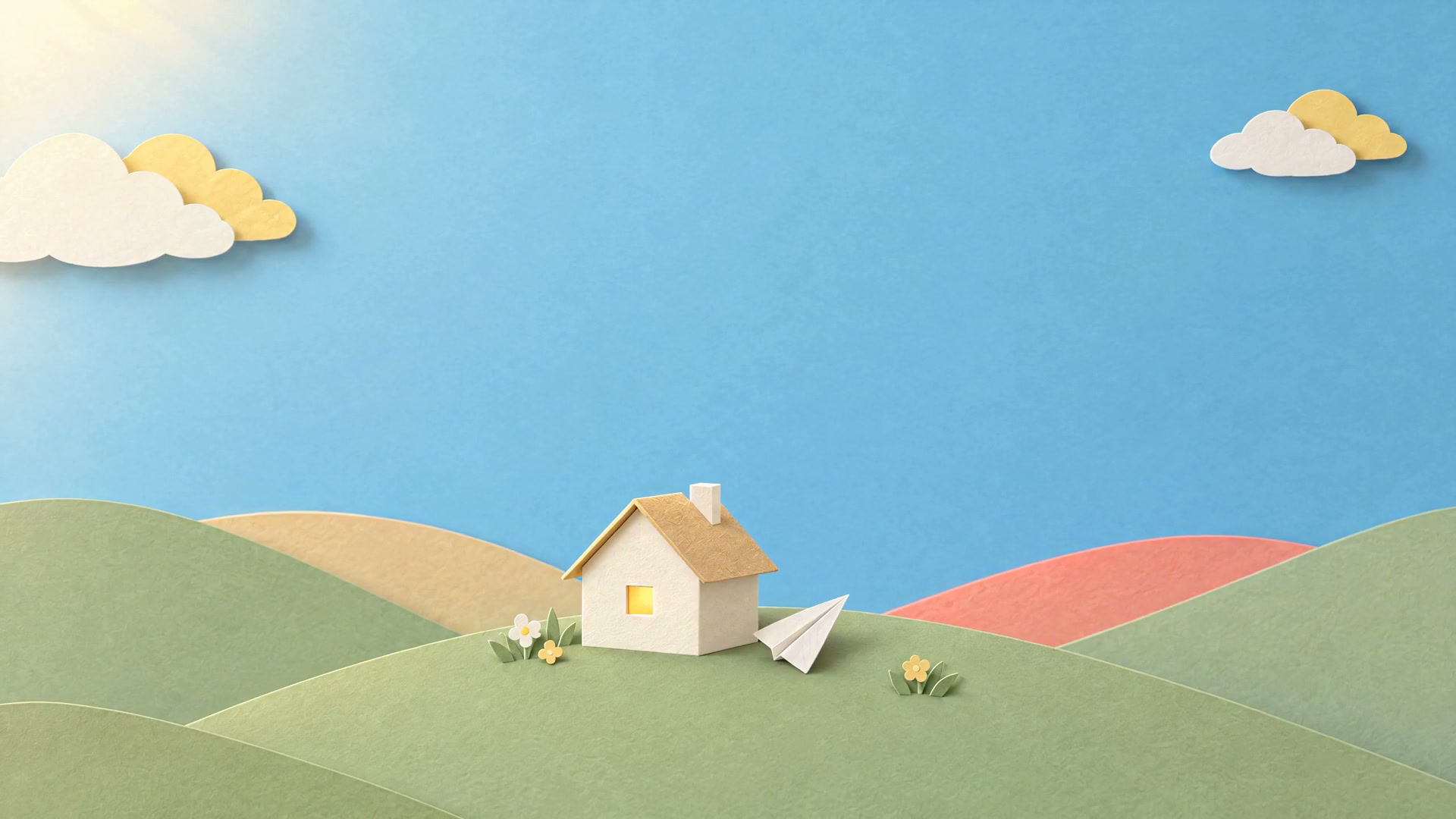 A paper plane resting on the grass beside a small paper house with a glowing window